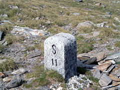 Italy/Switzerland border stone at Passo San Giacomo. Some borders were broadly defined by treaty, and surveyors would then choose a suitable line on the ground.