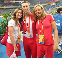 Jason Burnett (center) with the silver medal he won at the 2008 Summer Olympics Canadian gymnasts.jpg
