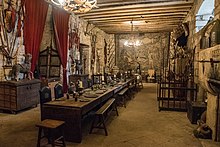 The Great hall, used as a filming location for the 1998 historical film Elizabeth. The fireplaces are film props. Chillingham Castle great hall.jpg