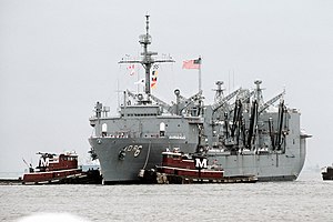 Commercial harbor tugs maneuver the replenishment oiler USS KALAMAZOO (AOR-6) toward the dock as the vessel returns to Norfolk from deployment in the Persian Gulf area during Operat - DPLA - e97387b07931e72c4ea1f29627808fbe.jpeg