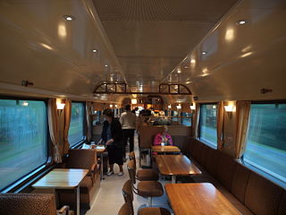 A dining car aboard a Finnish long-distance train from Helsinki, Uusimaa to Kolari, Lapland, photographed somewhere between Helsinki and Tampere, Pirkanmaa in 2015