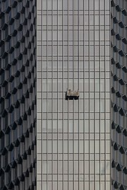 Façade hoist along the Andaz Hotel of Singapore at sunset