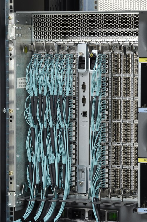 Fibre Channel director with SFP+ modules and LC optical fiber connectors with Optical Multimode 3 (OM3) fiber (aqua)