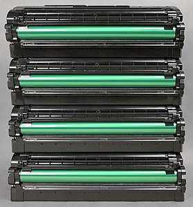 Four Samsung laser toner cartridges front view gray background
