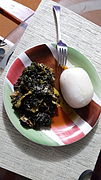 Akpu (fermented cassava swallow) served with edikaikong