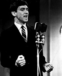 Gene Pitney (pictured in 1967) scored his first and only UK number-one single in January 1989 after teaming up with Marc Almond for a duet version of Pitney's 1967 hit single "Something's Gotten Hold of My Heart", which topped the chart for four weeks. Gene Pitney 1967.JPG
