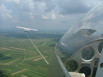 Tow line and towing aircraft seen from the cockpit of a glider Glider in flight.JPG