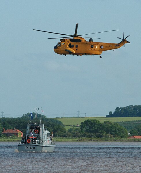 File:HMS Explorer (P164) and Westland Sea King air-sea rescue helicopter.JPG