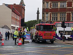 Humberside Fire & Rescue's DH23P4, a 2017 Scania P280 with EmergencyOne water ladder (WrL) bodywork based at Scunthorpe fire station (DH23) and wrapped in Pride livery, leads the way shortly before the beginning of Pride in Hull 2022.