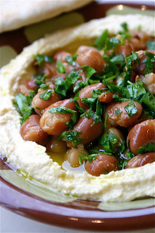 <span class="mw-page-title-main">Ful medames</span> Cooked fava beans served with olive oil, cumin, and other ingredients