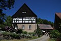 Wohnstallhaus, Seitengebäude, Scheune und weiteres Seitengebäude (Umgebinde) eines Vierseithofes