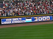 An electronic banner announces John Smoltz' 3000th strikeout during a game in April 2008. John Smoltz 3000 strikeouts.jpg