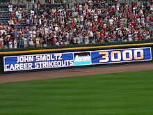 An electronic banner announcing the milestone achievement of John Smoltz recording his 3000th strikeout during a game in April 2008 John Smoltz 3000 strikeouts.jpg