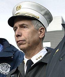 Battalion Chief Joseph W. Pfeifer, who made the first fire department radio message advising the FDNY Manhattan Fire Dispatch Office of the crash. Joseph W Pfeifer - NYPD Conducts Active Shooter Training Exercise (23265274449).jpg