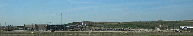 The Keele Valley Landfill which was closed in 2002, now overlooks nearby development Keele valley lowes development.jpg