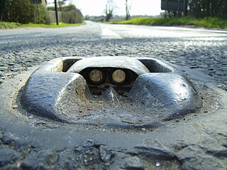 Cats eye (road) retroreflective safety device used in road marking