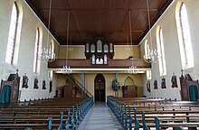 Vue intérieure de la nef vers la tribune d'orgue