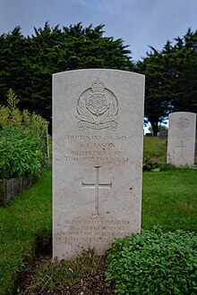 A Commonwealth War Grave headstone, with Casson's name and the crest of the Intelligence Corps