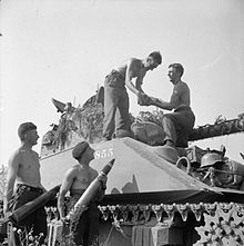 Loading 17-pounder APCBC rounds into a Firefly