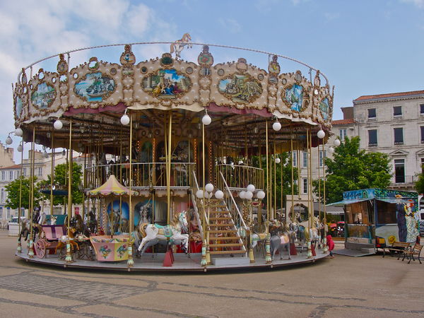 A French old-fashioned carousel with stairs in La Rochelle