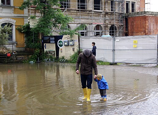 A little boy creates his own flood waves