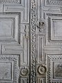 Closeup of the marble door with key and keyhole