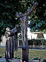 Sculpture of Padre Pio with Jesus on the cross in Prato, Italy