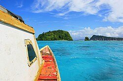 Heading towards Nu'ulopa island in a boat. Apolima Tai village on Apolima island is to the right and Savai'i island in the distance. Nu'ulopa island - Samoa.jpg