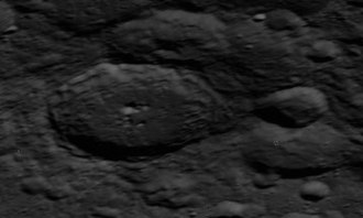Oblique Apollo 14 image, facing east. Olcott is left of center, Olcott E and M on right Olcott crater AS14-71-9889.jpg