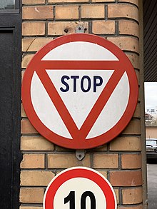 A circular stop sign in France. The Vienna Convention on Road Signs and Signals still allows this older style Panneau Stop Square Georges Guyon - Maisons-Alfort (FR94) - 2021-03-22 - 1.jpg