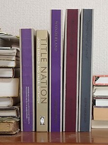 From left to right: Wonderland (2009), Title Nation (with Valeri Nistratov), Wonderland (2020), Black Garden, Departure Lounge Photobooks by Jason Eskenazi.jpg