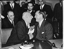 Prime Minister Mohammad Mossadegh of Iran speaking with Ernest A. Gross.jpg