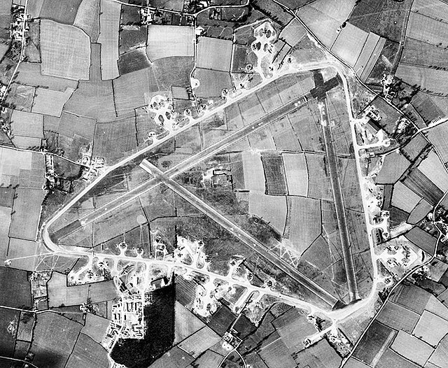 Aerial photograph of Great Ashfield airfield 31 March 1944. Note the large number of 385th Bomb Group B-17s on hardstands parked around the Perimeter 