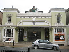 Entrance to Royal Victoria Arcade with metal railings in the centre