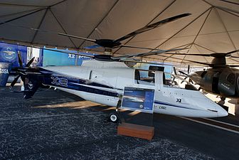 Sikorsky X2 Powered rotor, pusher propeller, no wings.