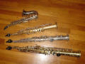 Top to bottom: a curved E♭sopranino saxophone, a straight E♭sopranino saxophone, a C soprano saxophone, and a B♭soprano saxophone