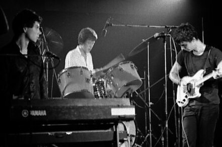 Harrison (left), Frantz (middle) and Byrne (right) performing with Talking Heads in 1978