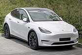 A front three-quarters view of a white Tesla Model Y