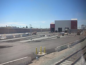 The Caltrain Centralized Equipment Maintenance and Operations Facility, taken from a train looking north, just prior to the completion of construction.