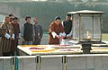 The King of Bhutan, HM Jigme Khesar Namgyel Wangchuck paying floral tributes at the Samadhi of Mahatma Gandhi, at Rajghat, in Delhi on December 22, 2009.jpg