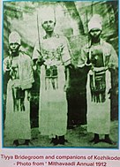 The traditional attire of Thiyyar (Tiyya) Bridegroom and companions who dressed as warriors and holding raised sword in their right hand ,in 1912