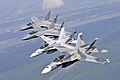 US Navy 090711-N-9712C-011 Two F-A-18 Hornets assigned to Strike Fighter Squadron (VFA) 204 and two F-15 Strike Eagles assigned to the Louisiana Air National Guard 159th Fighter Wing fly in an echelon formation.jpg