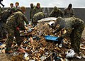 US Navy 110404-N-8607R-036 Marines assigned to the 31st Marine Expeditionary Unit (31st MEU) pick up debris on Oshima, as part of ongoing disaster.jpg