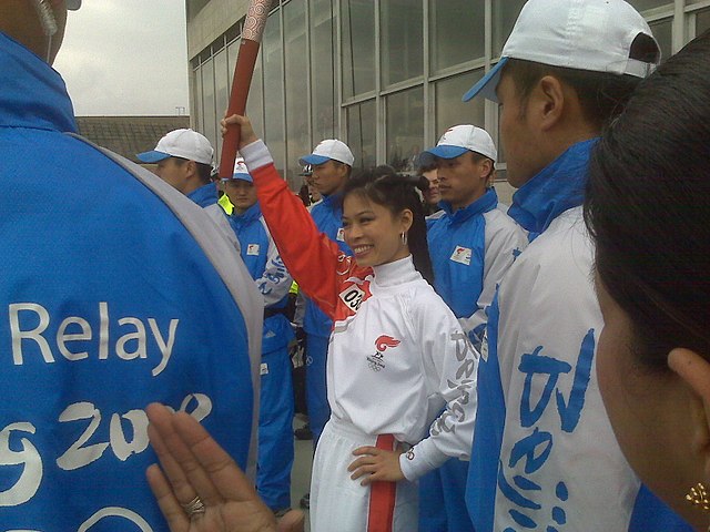 Vanessa-Mae at the Southbank Centre, London, England, carrying the Olympic torch, April 2008.