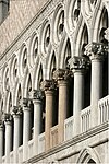 The loggia on the first floor of the Doges Palace (Piazzetta facade) with the two red columns between which traitors were executed