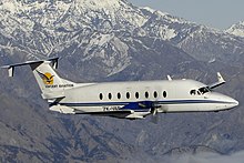 The 1900D has a larger cabin to allow passengers to walk upright inside Vincent Aviation Beechcraft 1900D (ZK-VAB) over New Zealand's South Island.jpg