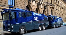 Two Saxony-Anhalt Bereitschaftspolizei Wasserwerfer 10000 water cannons in front of Dresden's central police station, 17 April 2021 Wasserwerfer der Polizei ST1 und ST2 - Sachsen-Anhalt - Einsatzraum Dresden - vor dem Polizeirevier Dresden Schiessgasse - am Samstag 17.April 2021 - Querdenkerdemo Einsatz - Bild 004.jpg