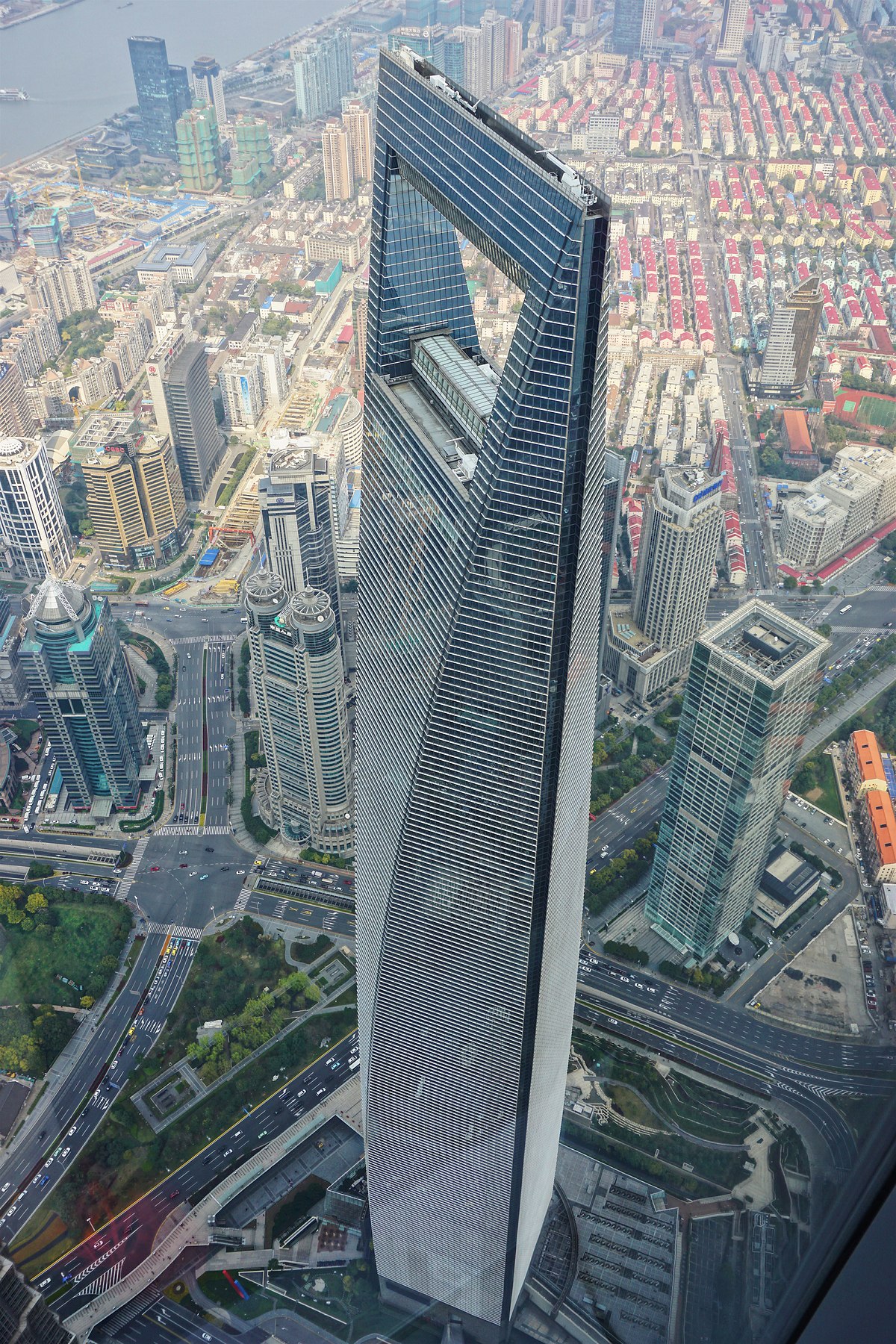 Daylight Sunny View To Hotel Building in Trapeze Shape with Flow