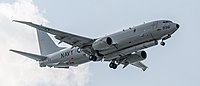 A Boeing P-8 Poseidon, tail number 168996, on final approach at Kadena Air Base in Okinawa, Japan. It has an AN/APS-154 Advanced Airborne Sensor (AAS) mounted underneath it.