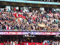 Leigh Leopards players making their way across Wembley's Royal Balcony to collect their 2023 Challenge Cup winners awards.